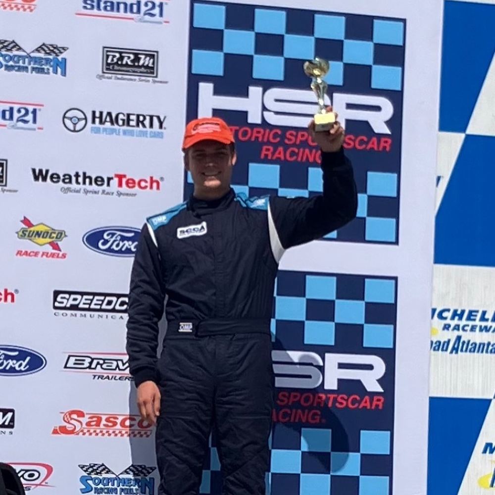 Carsten on the HSR podium at Road Atlanta holding a trophy